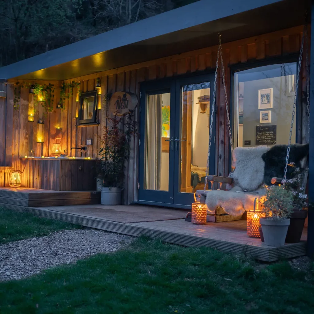 Veranda at dusk at The Roost Luxury Cabins