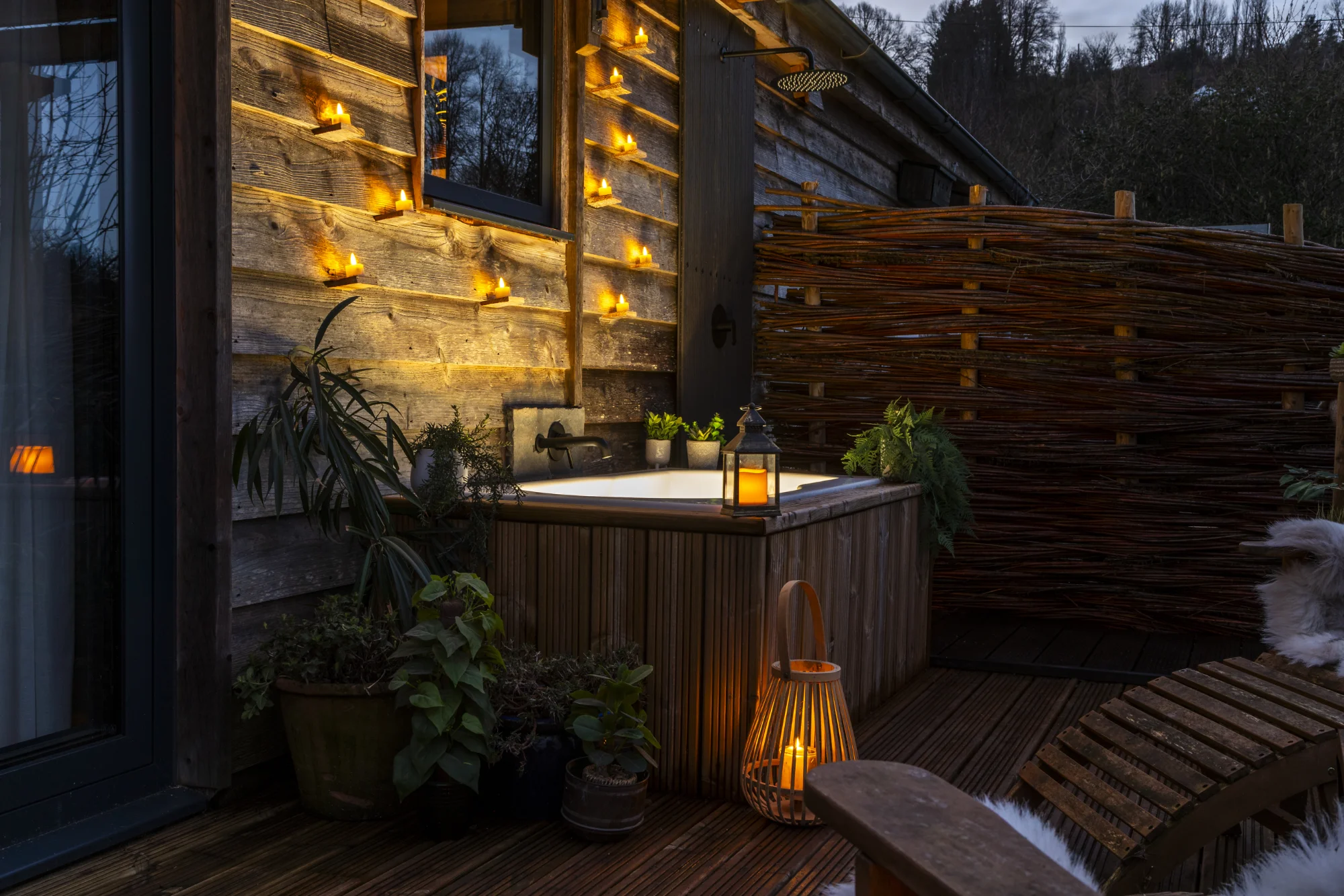 Nest veranda at dusk at The Roost Luxury Cabins